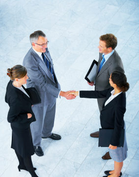 Business People Shaking Hands - Business Etiquette Errors